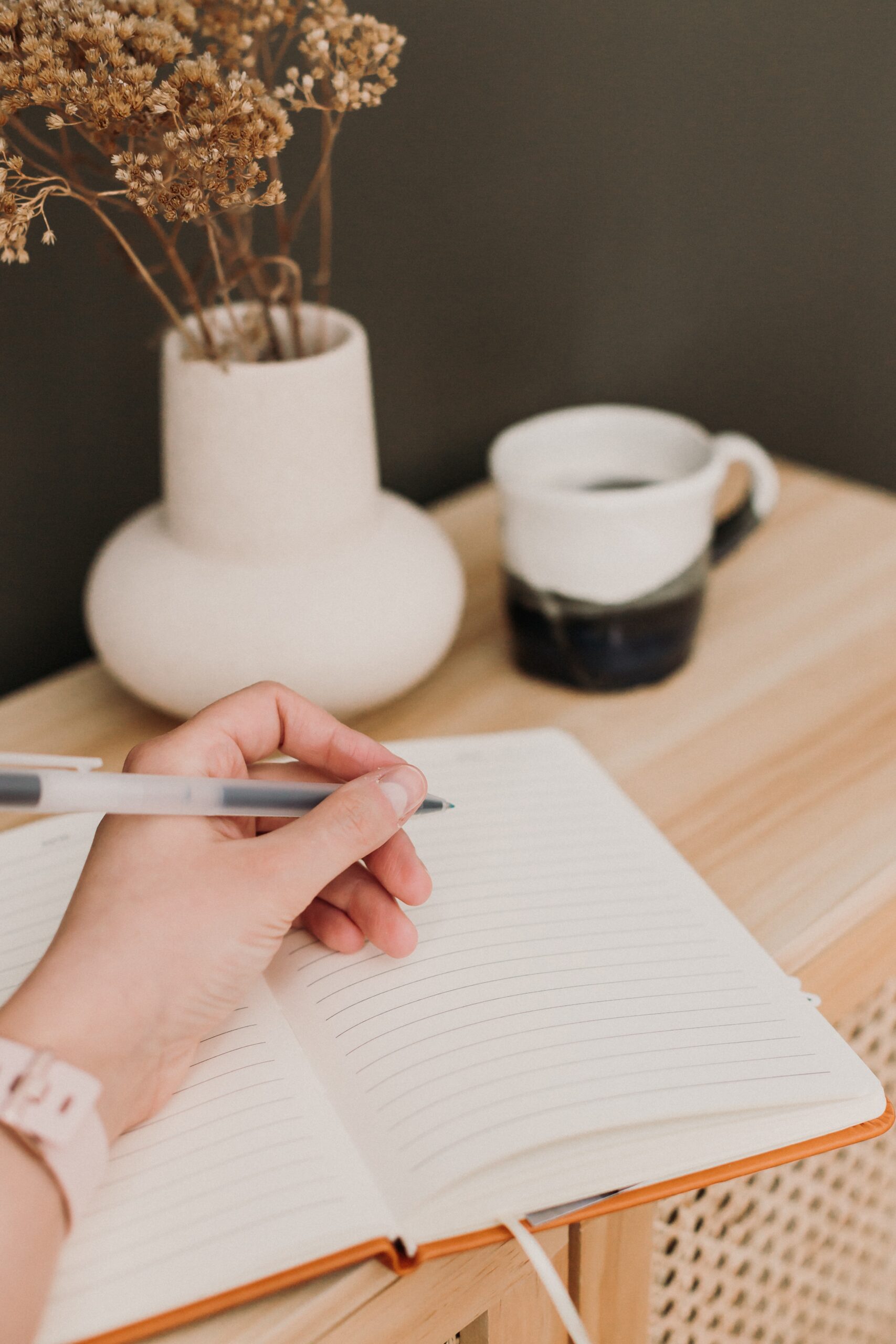 relationship communication woman writing in aesthetic notebook on desk