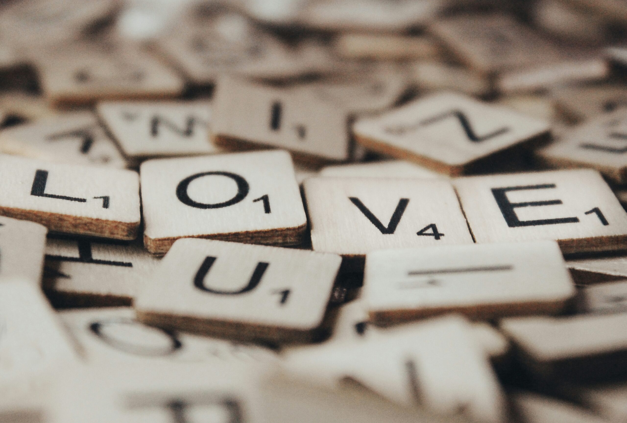 scrabble wood blocks spelling out love