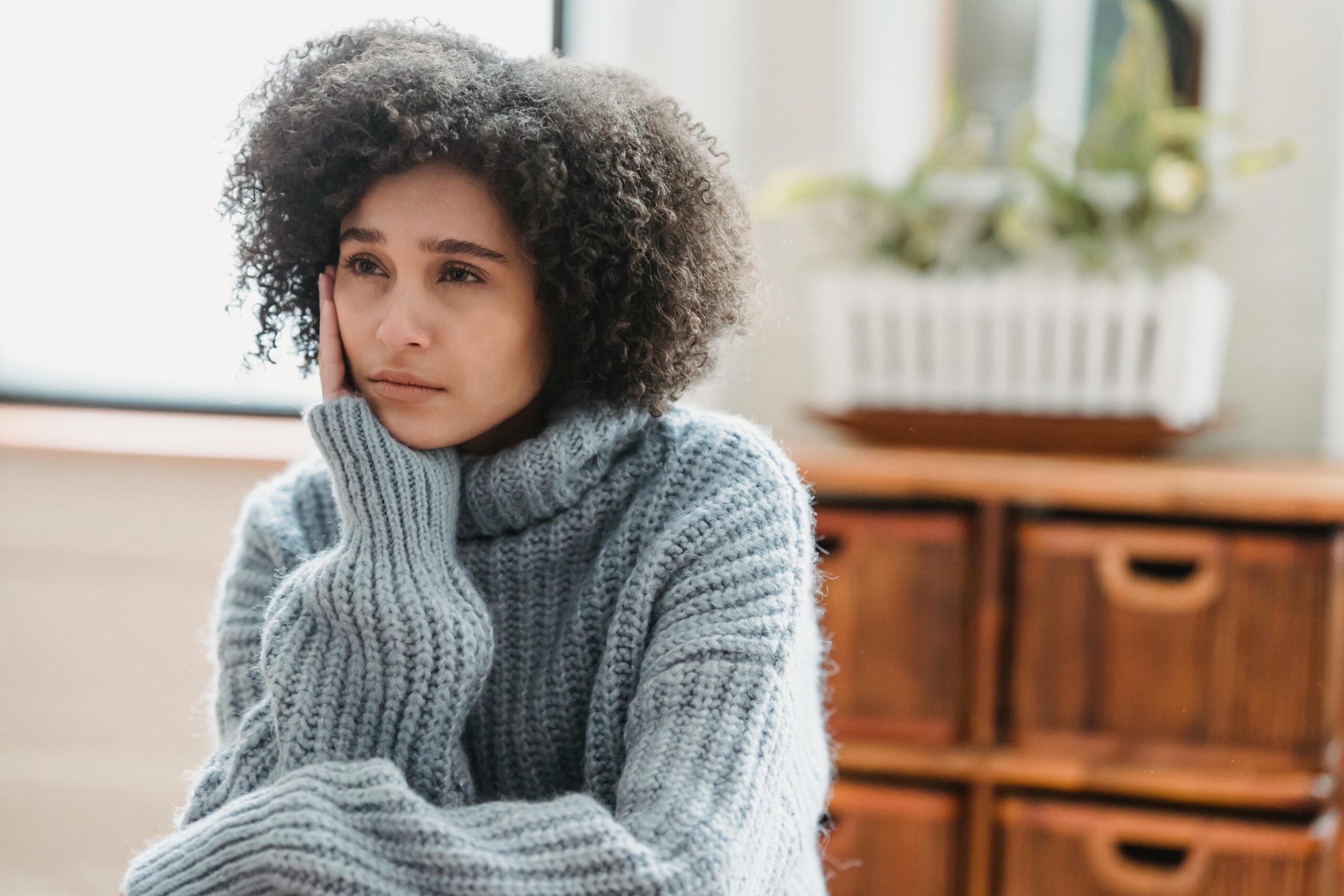 woman looking frustrated looking away from camera